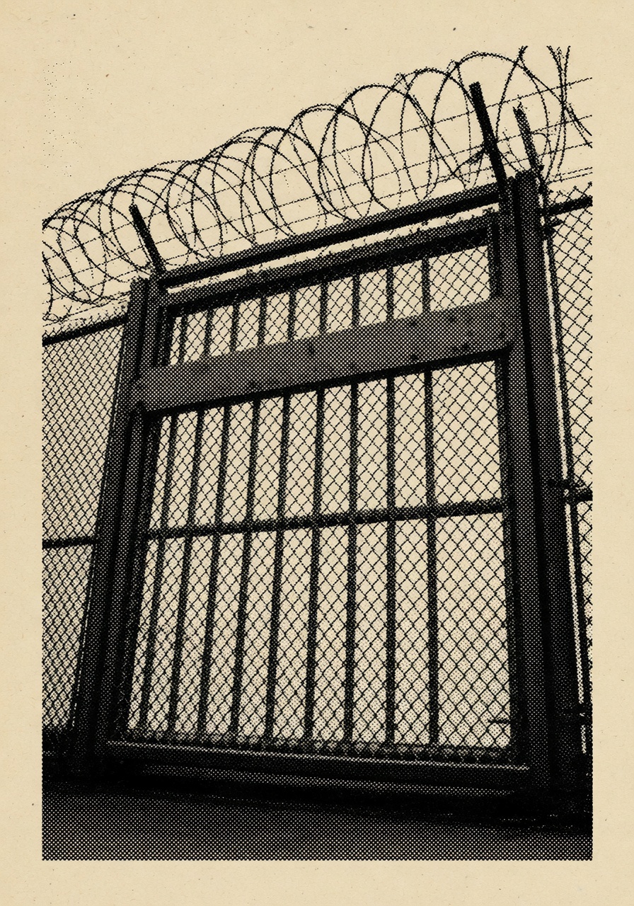 A high-contrast halftone illustration of a closed federal prison gate, viewed straight on from a slight low angle. Heavy steel mesh with a horizontal cross-bar runs across the frame; razor wire coils dominate the upper third. No human figures, no readable signage. Black ink dots on a warm paper-cream background, in the manner of a 1990s newspaper screen-press photograph.