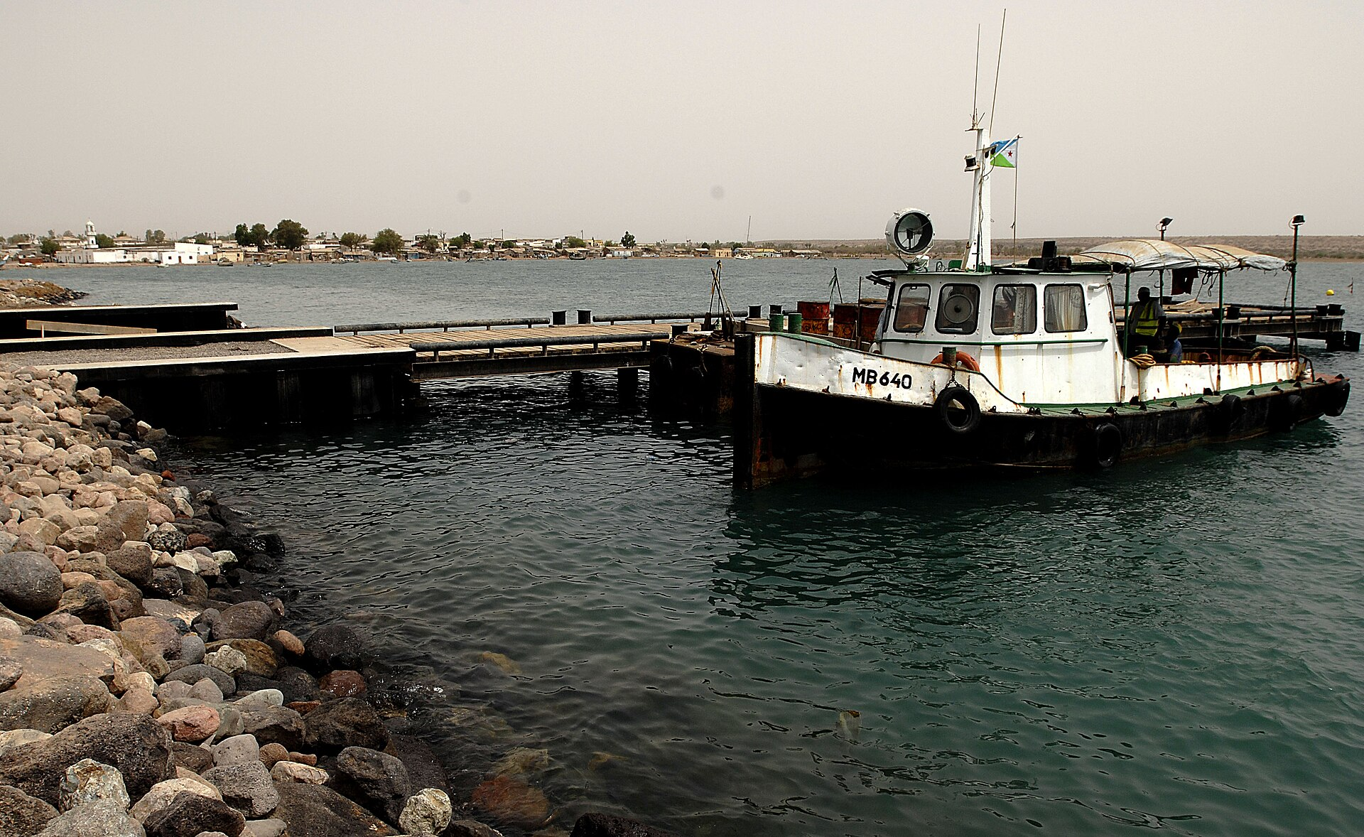 A small tugboat and pier at the port of Obock, Djibouti.