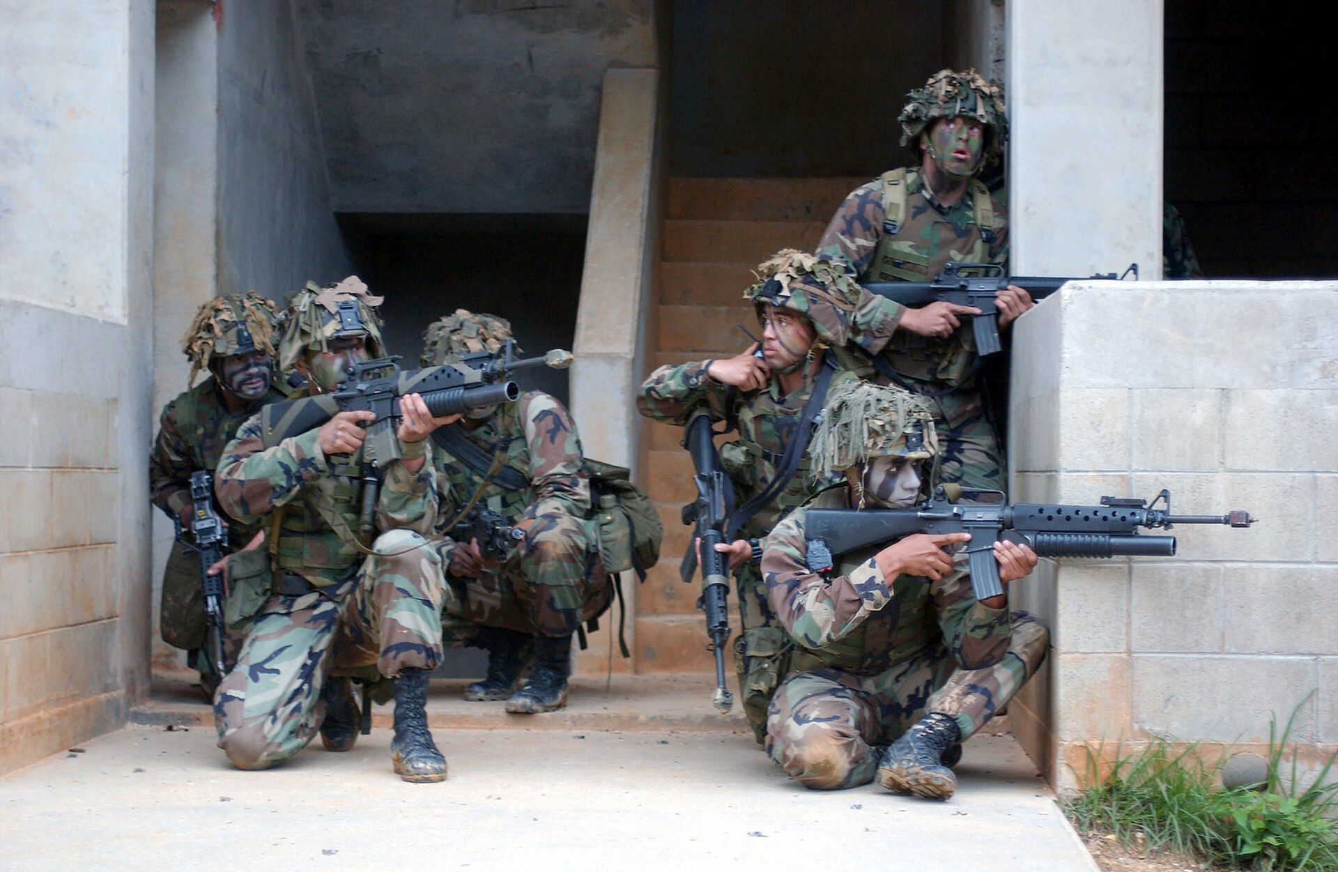 U.S. Marines from L Company, 3rd Battalion, 3rd Marine Regiment, 3rd Marine Division, practice Military Operations and Urban Terrain warfare at Camp Hansen, Central Training Area, Okinawa, Japan.